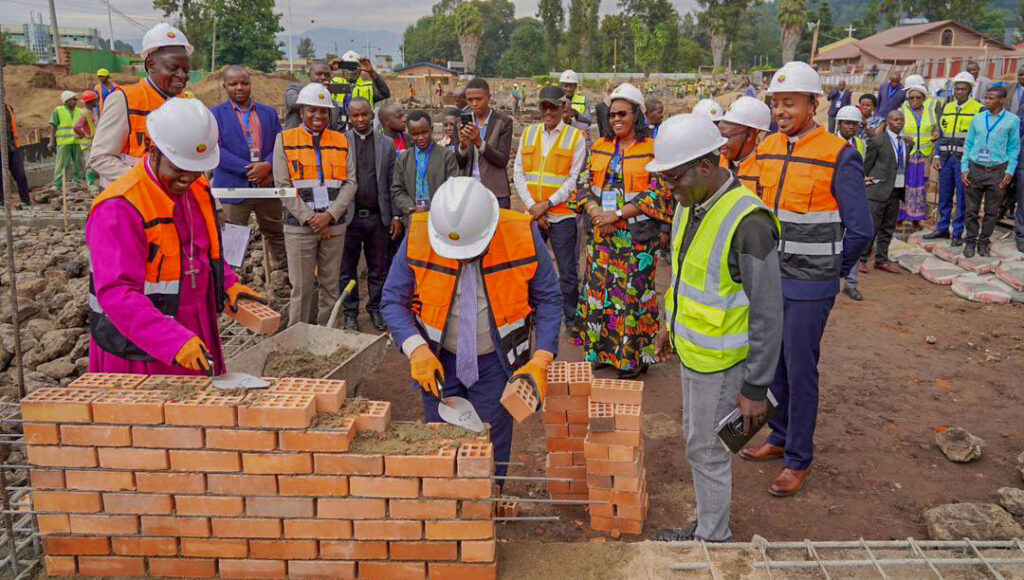 Laying the Foundation stone on the commercial building that is being constructed 